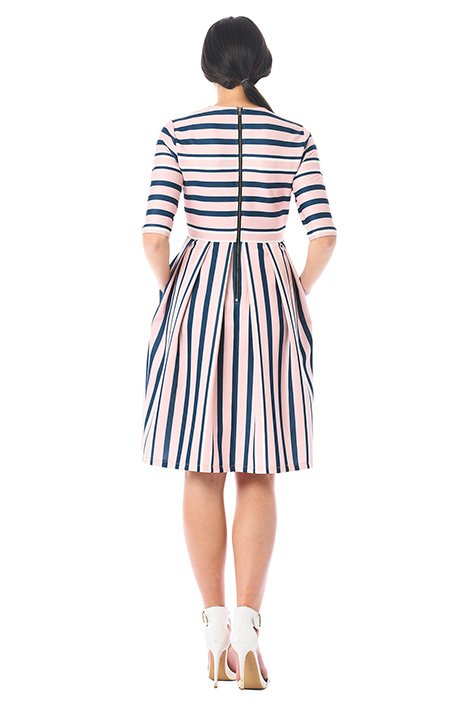 Stripes add modern attitude to our scuba knit dress in a flattering fit-and-flare silhouette for day-to-evening versatility.