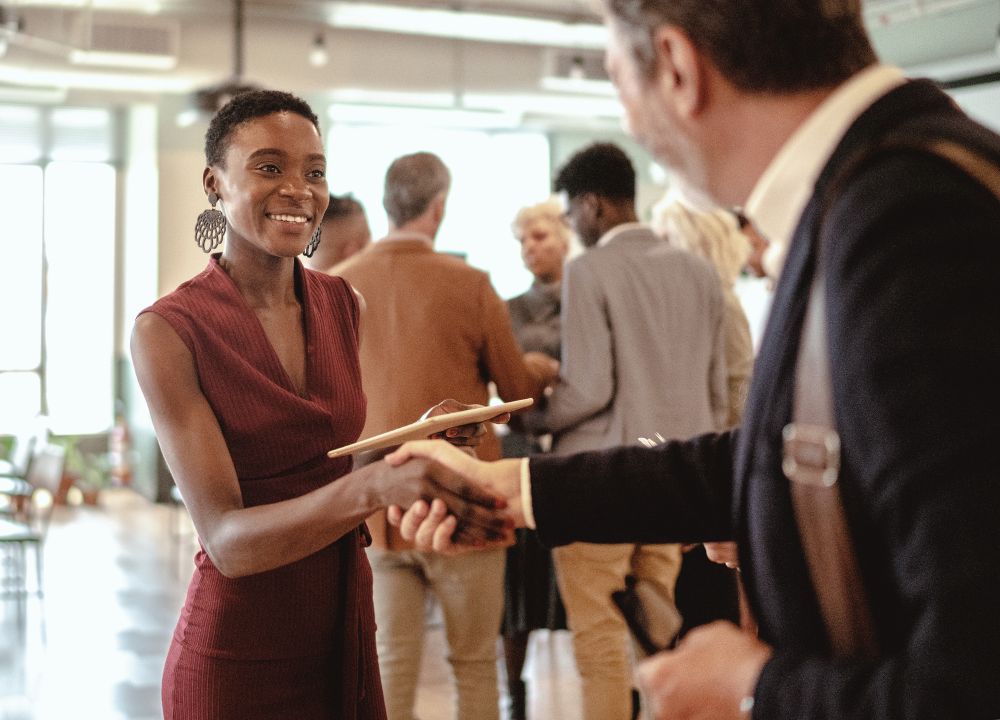 Two individuals conversing at a networking event