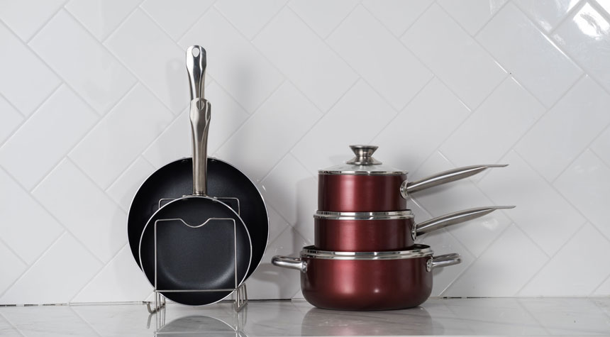 Close up of a nonstick cookware set on a kitchen shelf