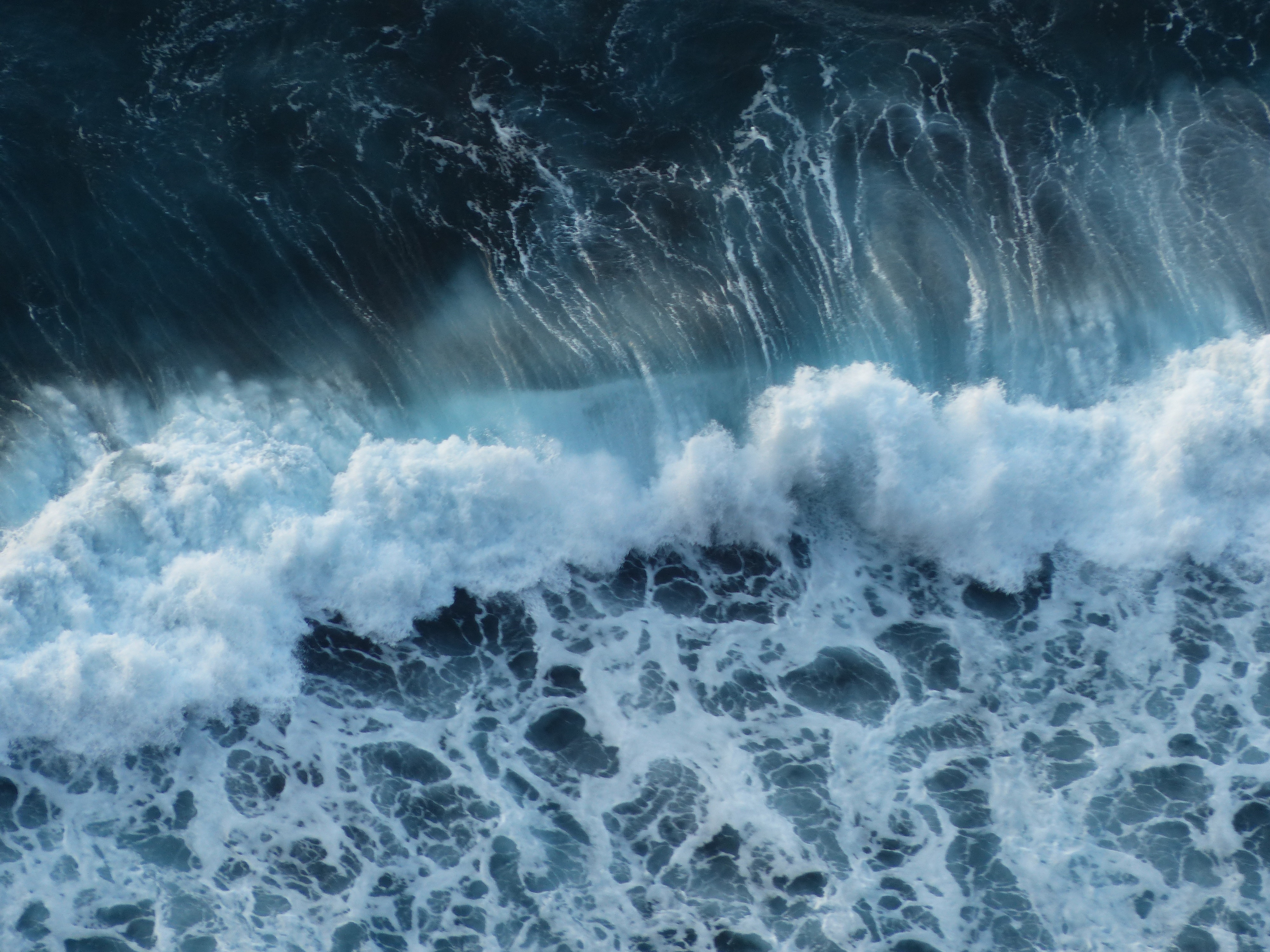 Blue Ocean Waves Crashing From Above |