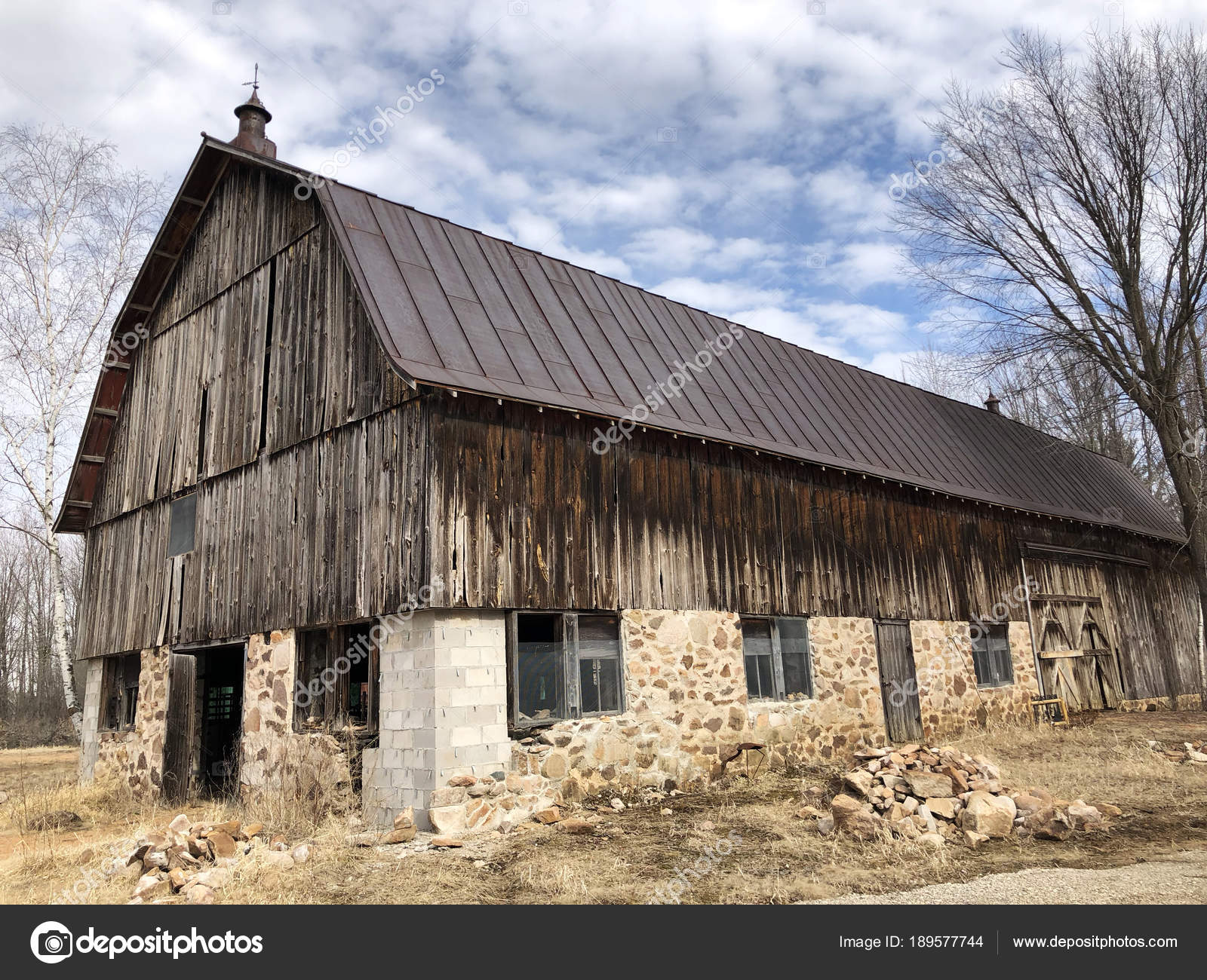 Old wooden barn against a blue sky — Stock Photo © dcwcreations ...