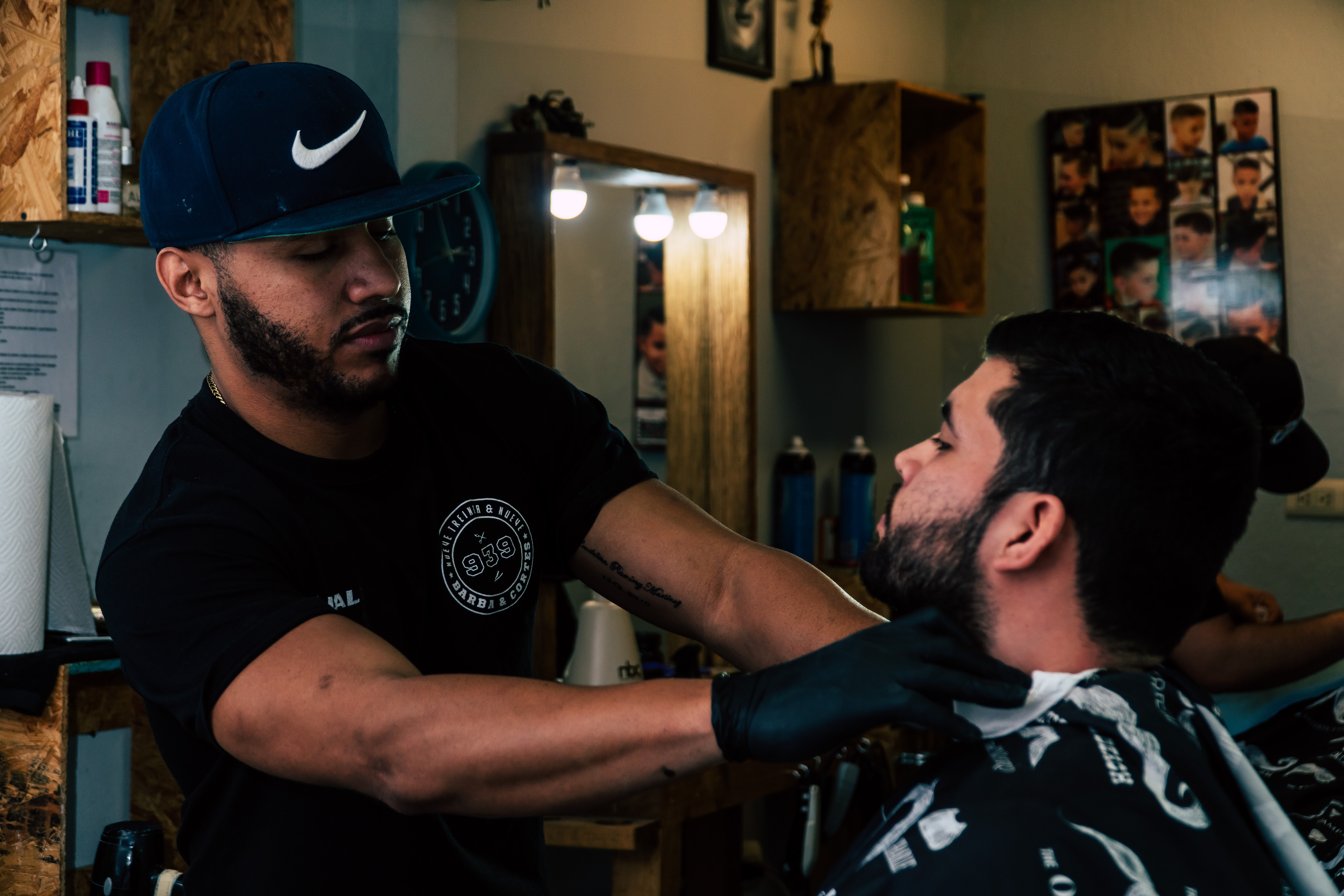 Person standing holding neck of man inside room photo