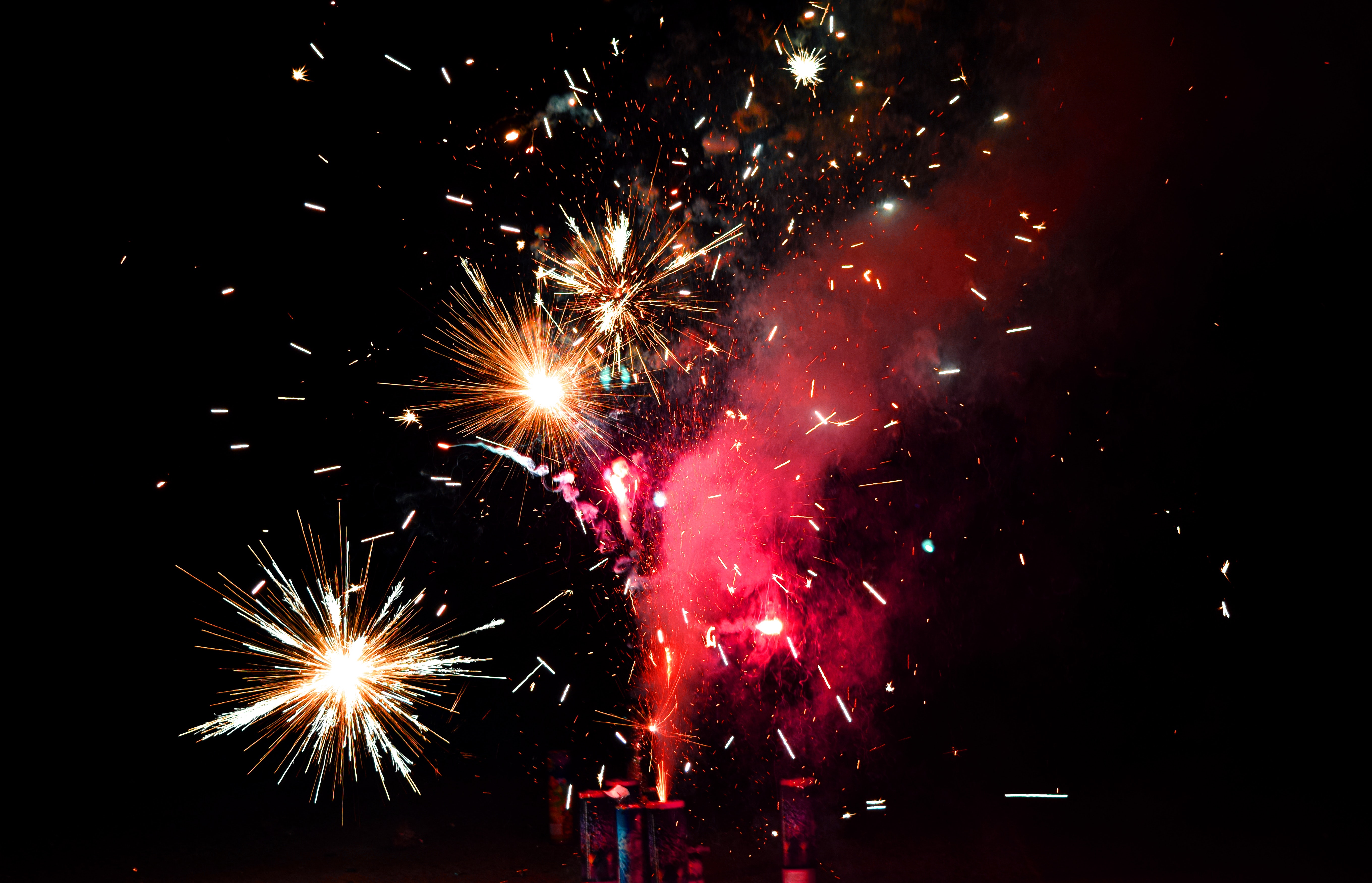 Red and yellow fireworks during night time photo