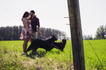 A lovely couple with two dogs