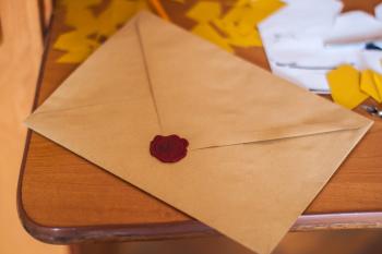 Brown Paper Envelope on Table