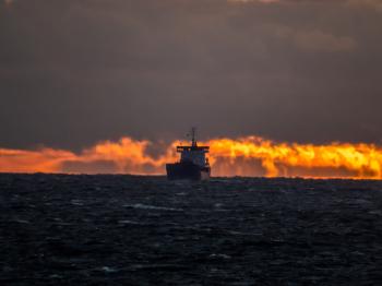 Ship on sunset fire