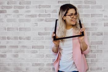 Woman Holding Black Photo Frame