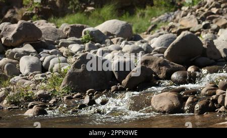 boulder stones in lake Stock Photo