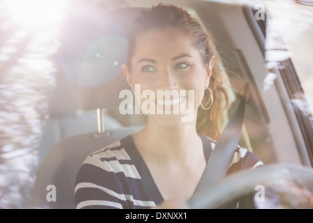 Happy woman driving car Stock Photo