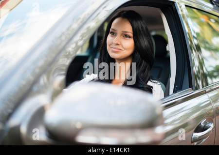 Hispanic woman driving car Stock Photo