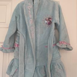 Blue velour dressing gown with pink trim and snowflake design