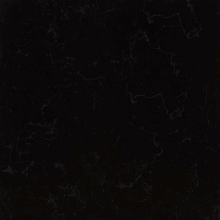 a close up of a black marble tile with a texture .