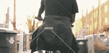 a man riding a bike with the word horizon on the back