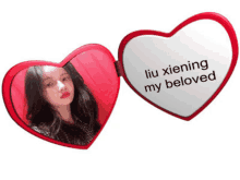 a heart shaped mirror with the words liu xiening my beloved on it