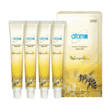 four tubes of atomy toothpaste with a box