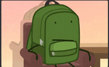 a green backpack is sitting in a chair with a sad face