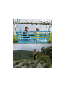 a woman sitting on a blue swing next to a body of water