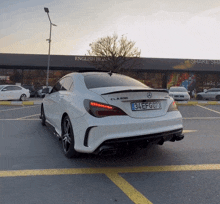 a mercedes cla 200 is parked in a parking lot