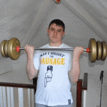 a man wearing a shirt that says may i suggest the sausage is lifting weights