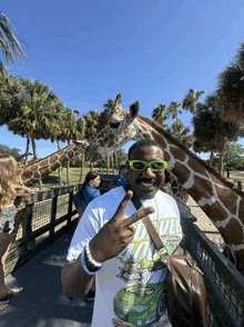 a man wearing sunglasses and a shirt that says duke on it