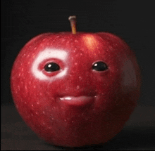 a red apple with a face drawn on it and the number 6 on its eyes