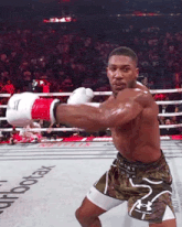 a man in a boxing ring with the word aerotax on the floor