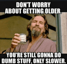 a man in a robe is holding a glass with a caption that says do n't worry about getting older .