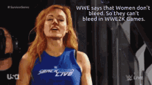 a woman wearing a blue shirt that says smack down live