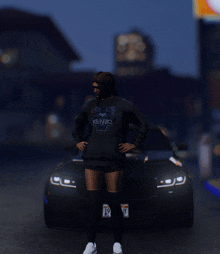 a woman in a kenzo sweatshirt stands in front of a car