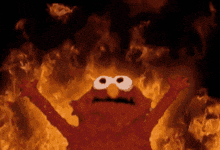 elmo from sesame street is surrounded by flames and smoke