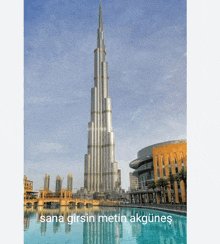 a picture of a very tall building with the words sana girsin metin akgunes