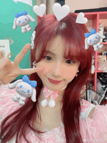 a girl with red hair is wearing a pink and white dress with cinnamoroll stuffed animals on her head