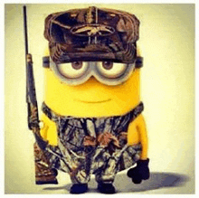 a minion is wearing a camouflage uniform and holding a gun .