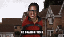 a woman wearing glasses and a red jacket with the words j.k. rowling friend on it