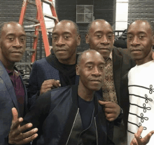 a group of men are posing for a picture with one wearing a shirt that says ' i love you ' on it