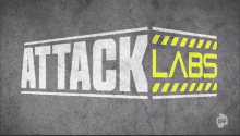 a logo for attack labs is on a concrete surface