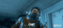 a man in a space suit is saying ow