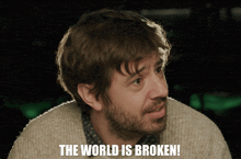 a man with the words the world is broken written on his face