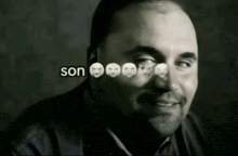 a black and white photo of a man with son written in white letters
