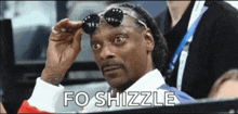 snoop dogg wearing sunglasses and the words fo shizzle