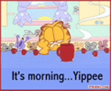 garfield is sitting at a table with a cup of coffee and says it 's morning yippee