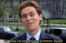 a man in a suit and tie says " you know i m something of a cheese myself "