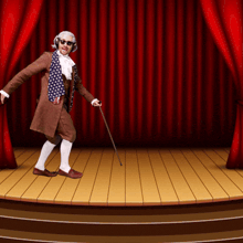 a man with headphones and a cane is walking on a stage