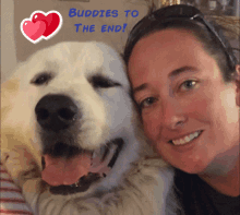 a woman hugs a white dog with the words " buddies to the end " behind her