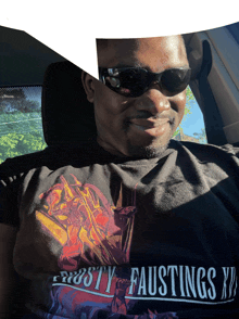 a man wearing sunglasses and a shirt that says frosty faustings on it