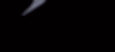 a blurred image of a person 's face in the dark