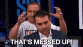 a man says that 's messed up while another man looks on