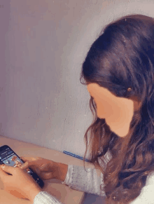 a woman is using a cell phone with a purple background