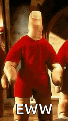 a cartoon character with a large finger on his head is standing in a room .