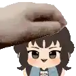 a person is petting a cartoon character 's head with their hand .